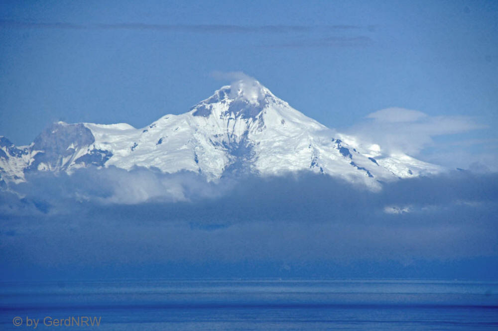 View of Volcano Mount Iliamna from Kenai Peninsula over Cook Inlet, Alaska, USA